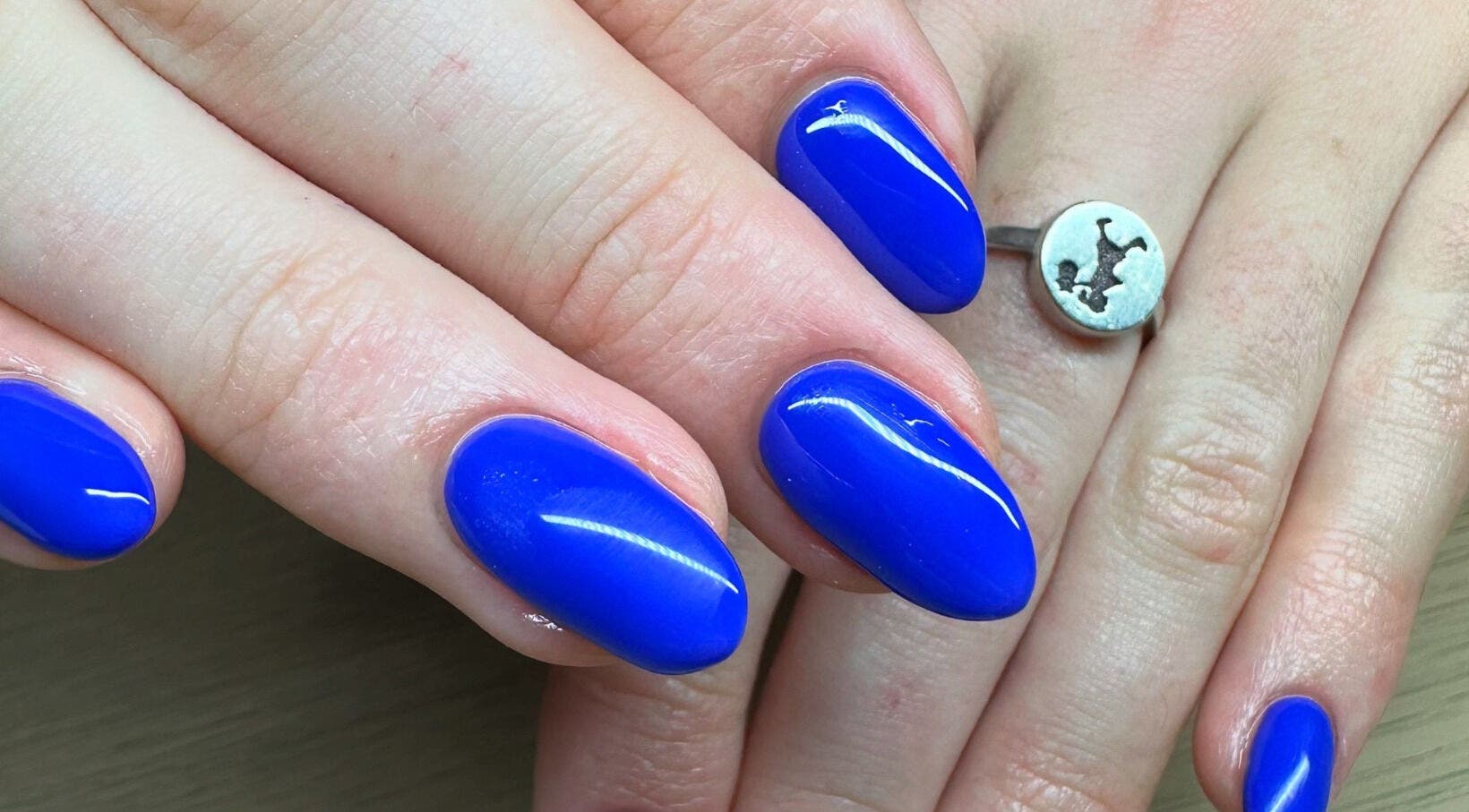 Bright blue nails manicure at The Cove - New Plymouth, enhancing beauty in New Plymouth, Taranaki, NZ.
