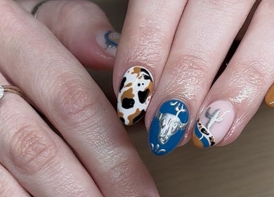Artistic nail designs at The Cove - New Plymouth in Taranaki, NZ featuring colorful patterns.