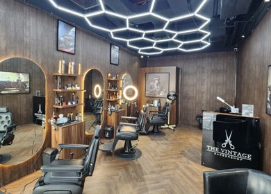 Stylish interior of The Barber House - Azizi Riviera, Dubai, Dubai, AE, featuring modern chairs and decor.