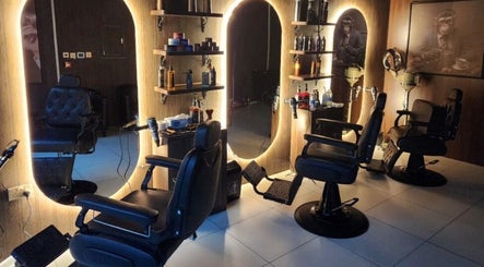 Elegant barbershop interior at The Barber House - Azizi Riviera, Dubai, Dubai, AE with stylish chairs and mirrors.