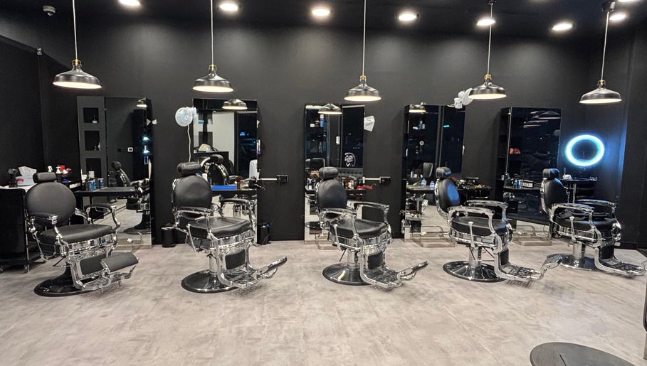 Elegant interior of The Barber House - JLT showcasing modern barber chairs in Dubai, Dubai, AE.