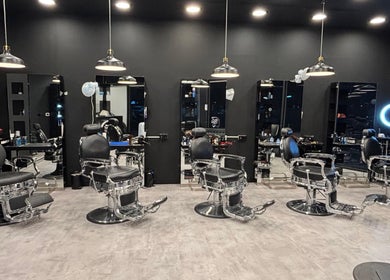 Elegant interior of The Barber House - JLT showcasing modern barber chairs in Dubai, Dubai, AE.