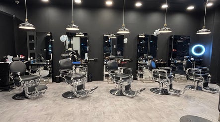 Elegant interior of The Barber House - JLT showcasing modern barber chairs in Dubai, Dubai, AE.