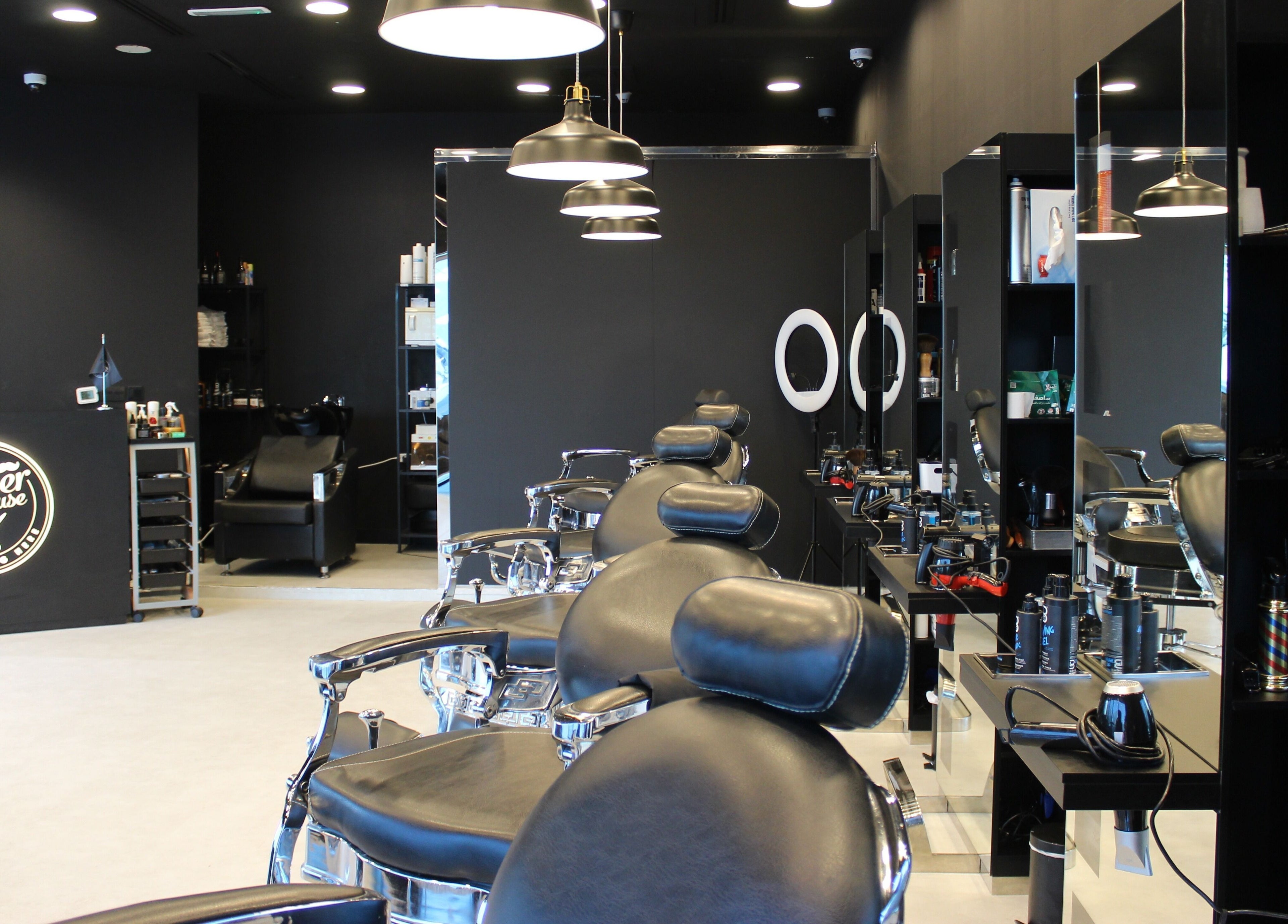 Interior of The Barber House - JLT, Dubai, Dubai, AE featuring sleek chairs and modern decor.