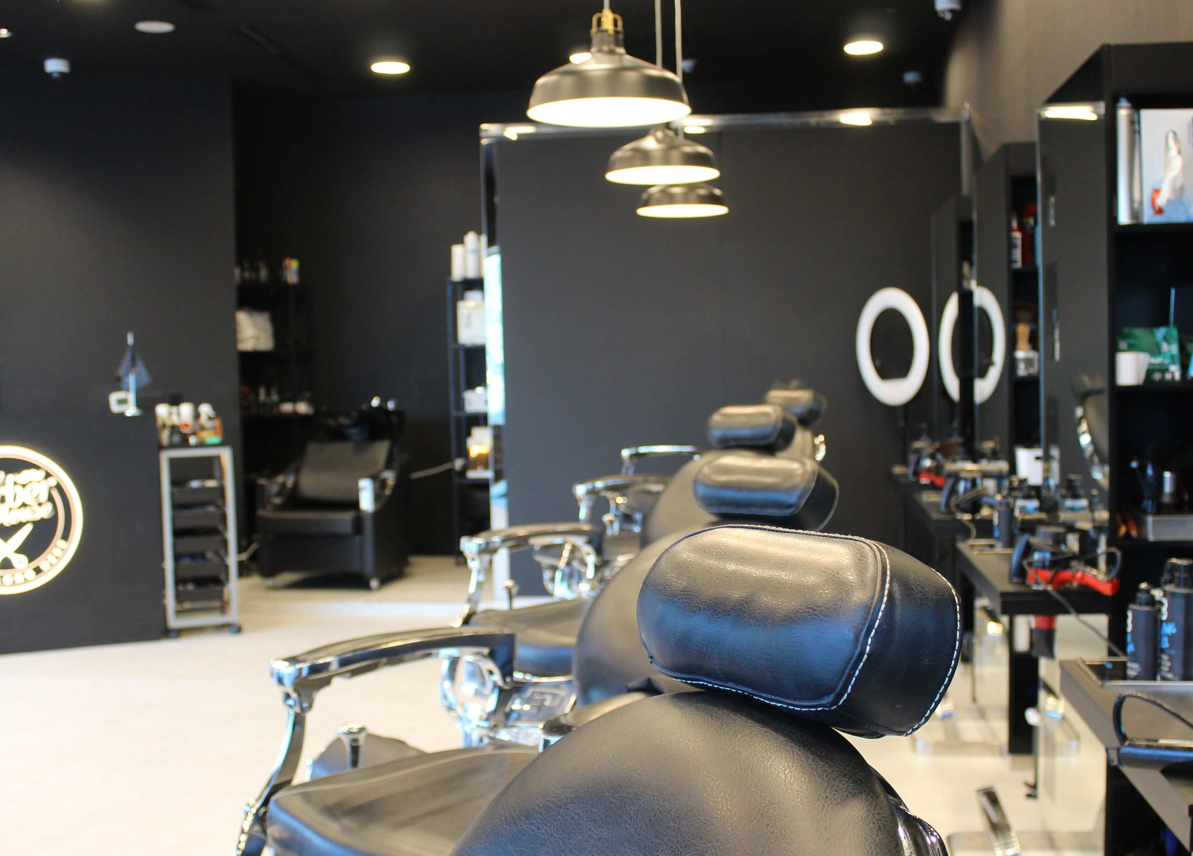 Sleek interior of The Barber House - JLT, Dubai, Dubai, AE showcasing stylish barber chairs and modern decor.