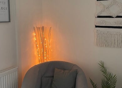 Cozy seating area with warm lighting at In-Touch Therapies by Frances, Pontypool, Wales, GB.