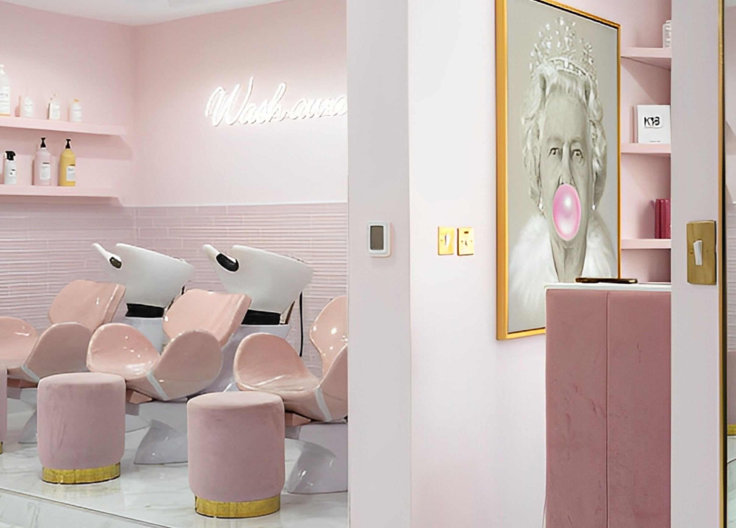 Sleek pink salon interior at The British Salon JLT, Dubai, Dubai, AE showcasing chic wash stations.