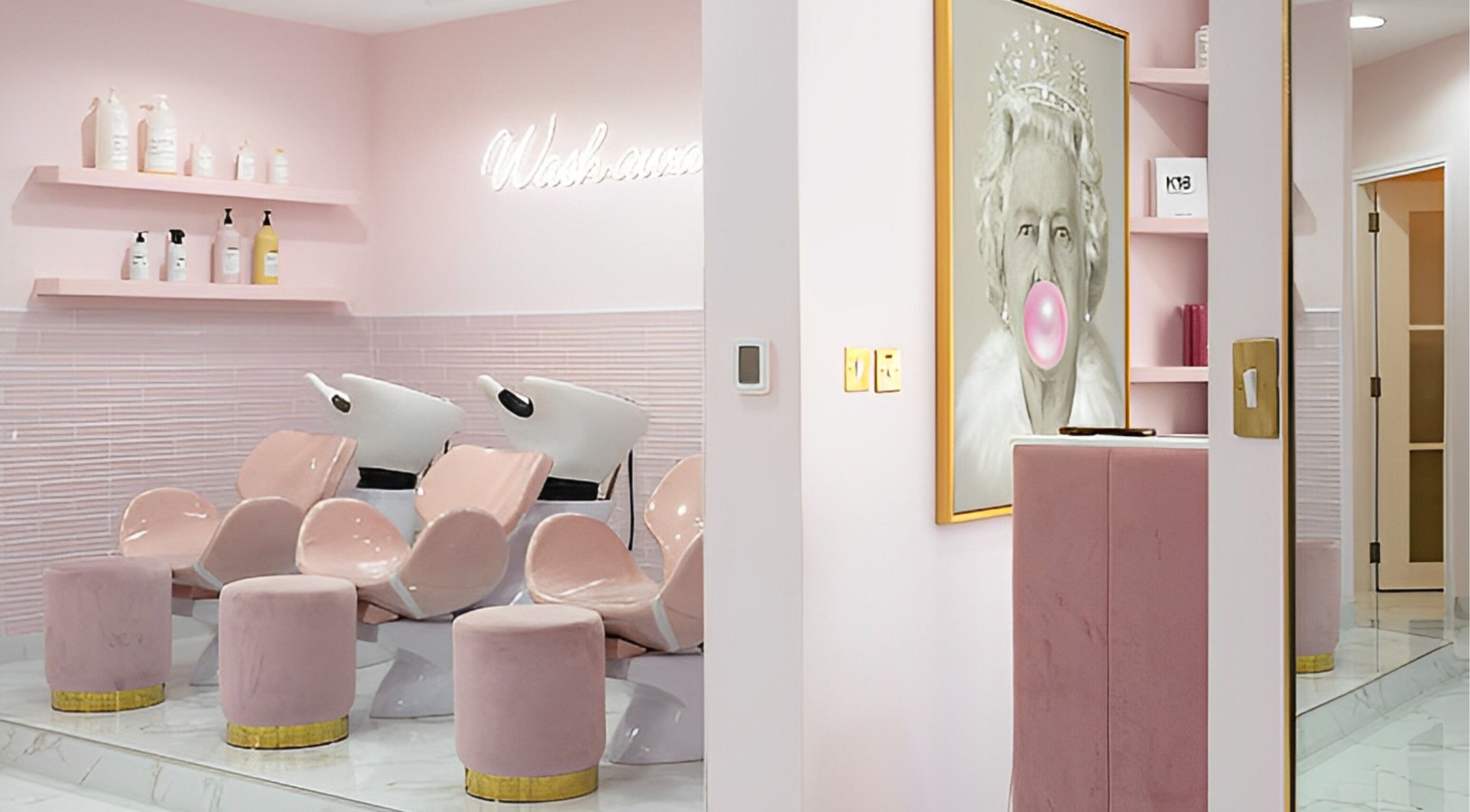 Sleek pink salon interior at The British Salon JLT, Dubai, Dubai, AE showcasing chic wash stations.