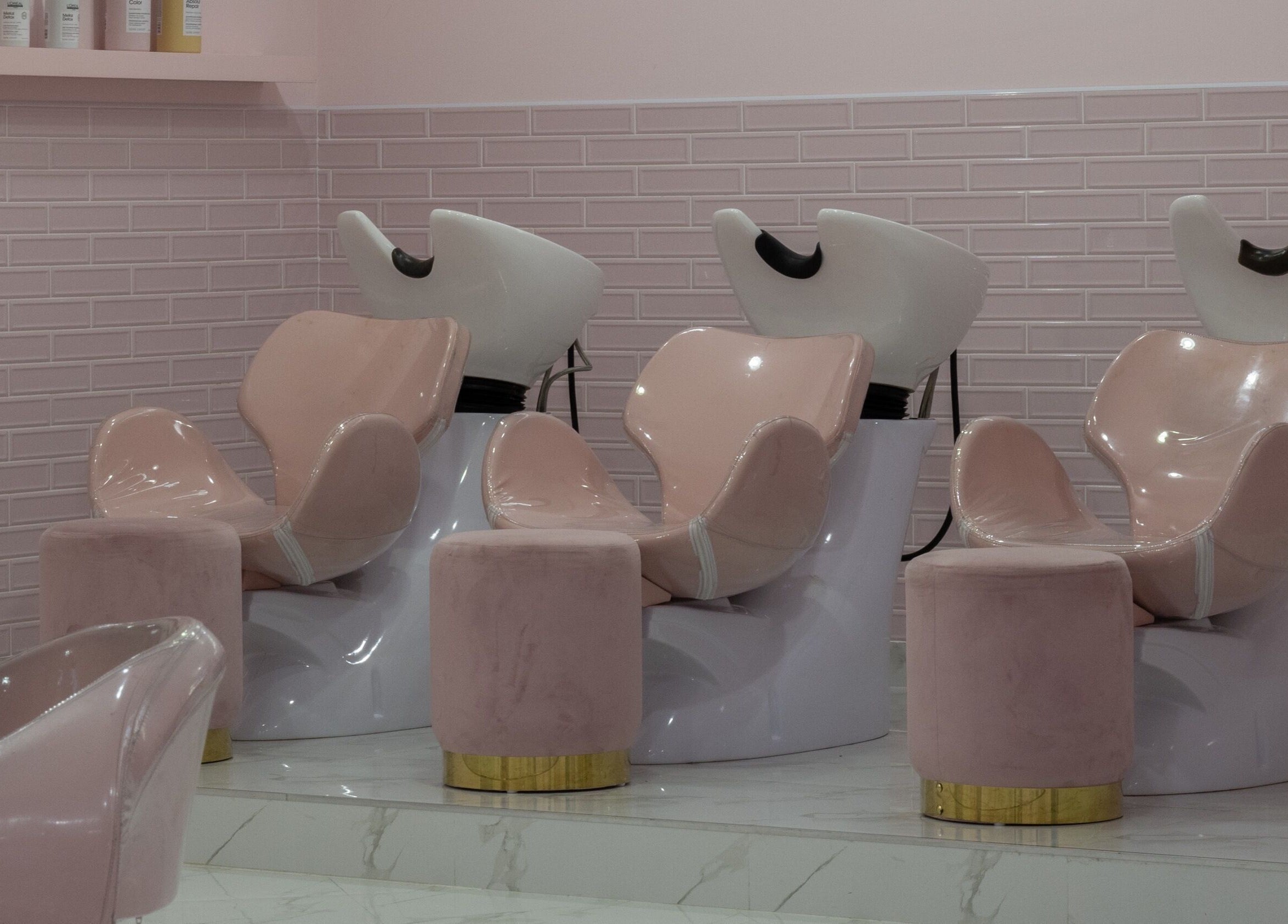 Elegant pink wash stations at The British Salon JLT, Dubai, Dubai, AE offer luxurious hair care services.