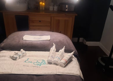 Tranquil treatment room at Renew Beauty Studio, Bangor, Northern Ireland, GB, with skincare products displayed.