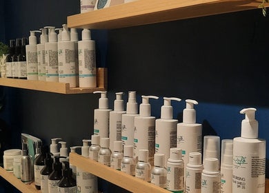Skincare products on wooden shelves at Renew Beauty Studio, Bangor, Northern Ireland, GB.