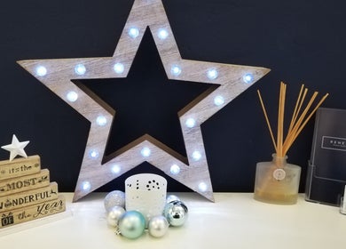 Illuminated star decor at Renew Beauty Studio, Bangor, Northern Ireland, GB, enhancing a festive ambiance.