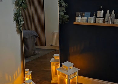 Cozy ambiance at Renew Beauty Studio in Bangor, Northern Ireland, GB with decorative lanterns and product display.