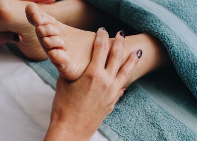Foot massage at Renew Beauty Studio, Bangor, Northern Ireland, GB, offering soothing wellness services.