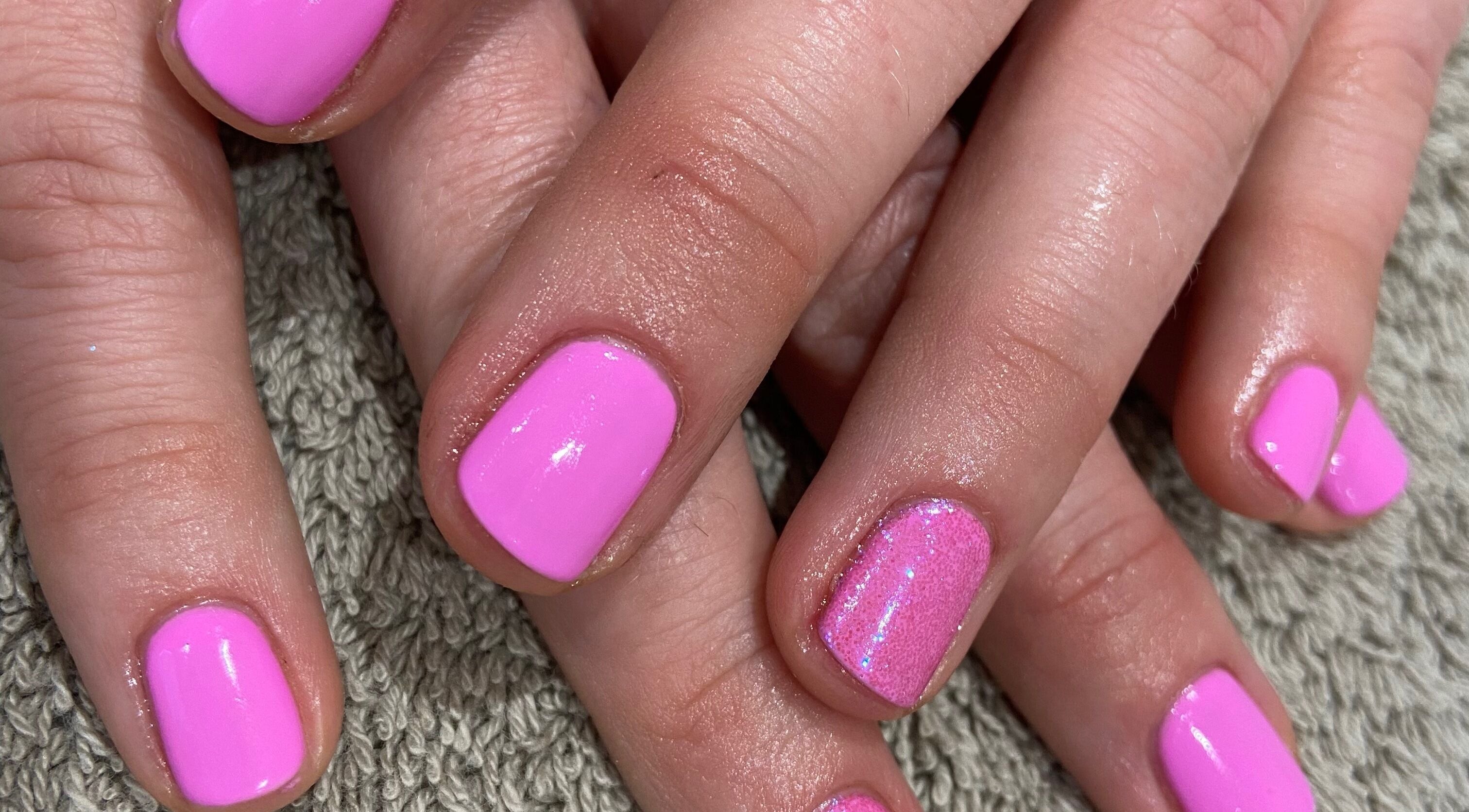 Vibrant pink manicure at Beauty with Becky in Southend-on-Sea, England, GB.