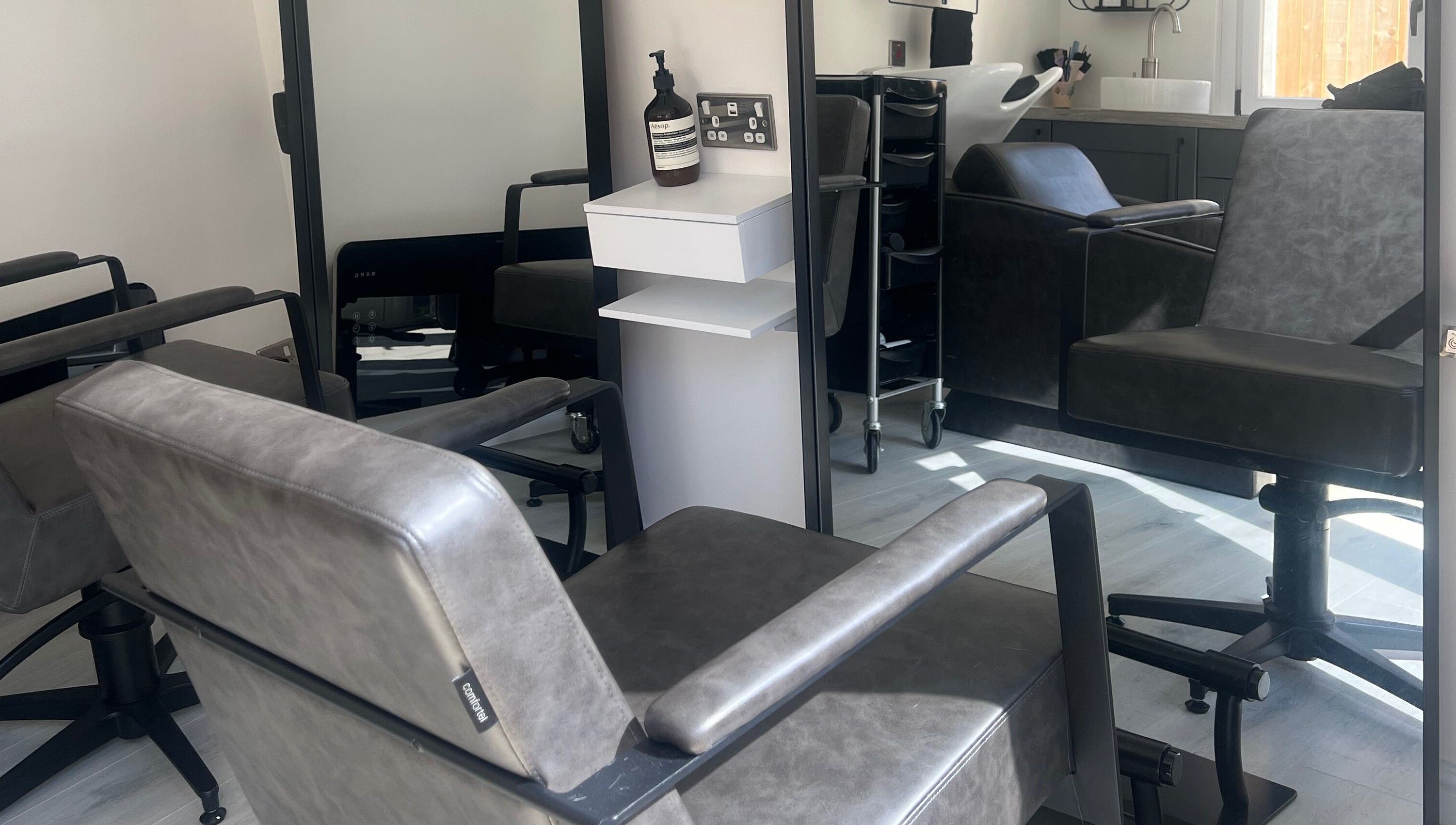 Modern salon chairs at The Studio by Lois, Shefford, England, GB, showcasing a sleek and inviting atmosphere.