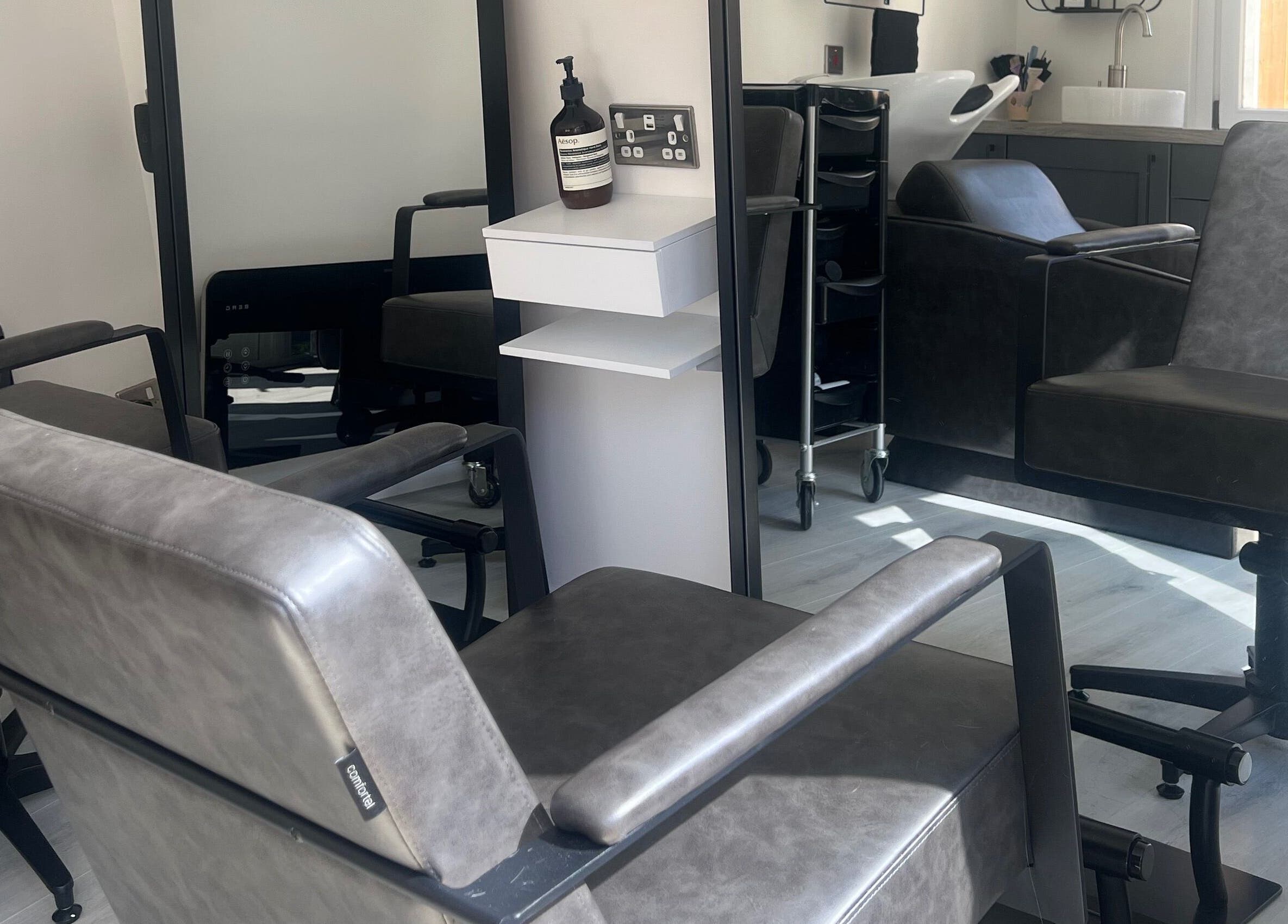 Modern salon chairs at The Studio by Lois, Shefford, England, GB, showcasing a sleek and inviting atmosphere.