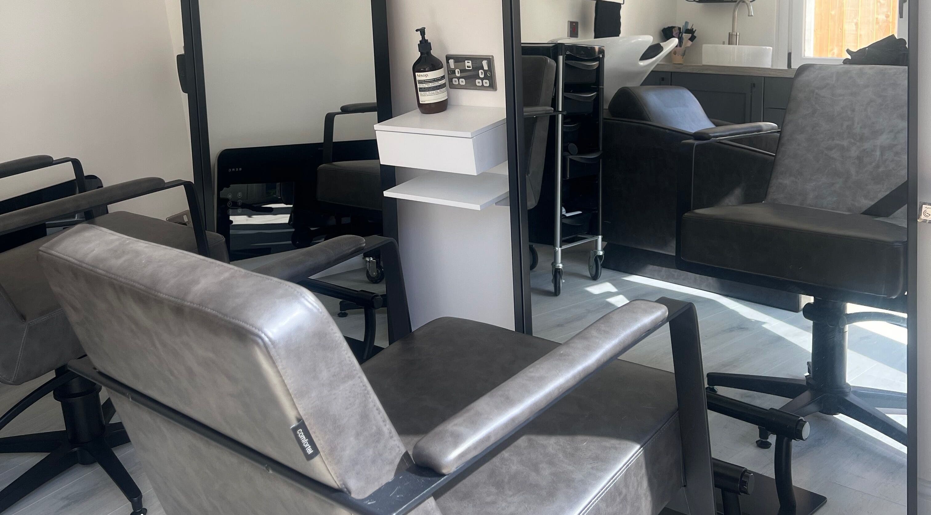 Modern salon chairs at The Studio by Lois, Shefford, England, GB, showcasing a sleek and inviting atmosphere.