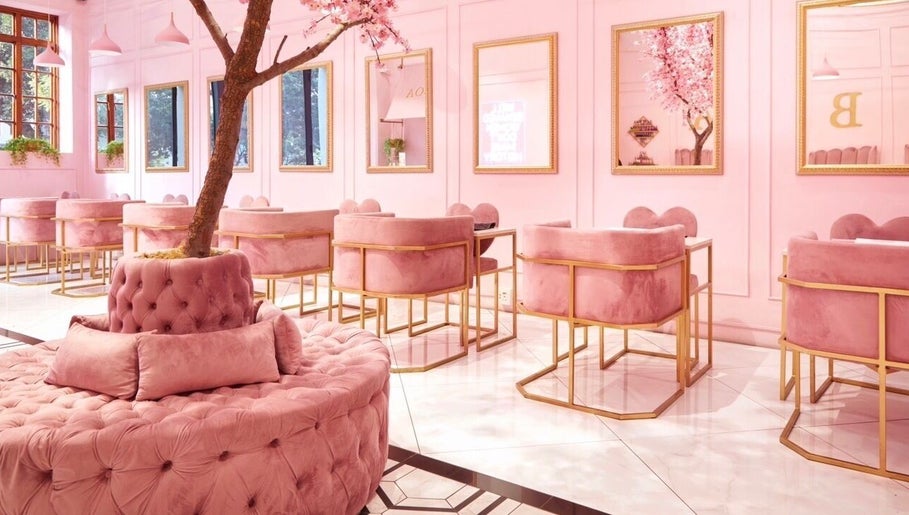 Luxurious pink interior at Boa Beauty Bar - Bree Street, Cape Town, Western Cape, ZA with plush seating and decor.