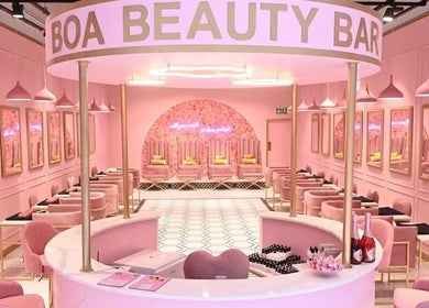 Elegant interior of BOA Beauty Bar - Mall Of The South, Alberton, Gauteng, ZA with pink decor and stylish seating.