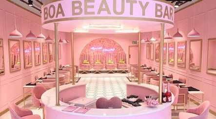 Elegant interior of BOA Beauty Bar - Mall Of The South, Alberton, Gauteng, ZA with pink decor and stylish seating.