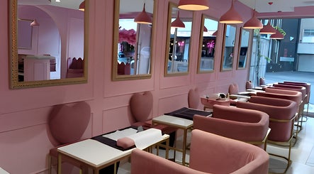 Stylish pink interior at BOA Beauty Bar Kloof Street in Cape Town, Western Cape, ZA, featuring modern seating.