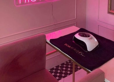 Elegant manicure station at BOA Beauty Bar Rondebosch, Cape Town, Western Cape, ZA with a plush pink chair.