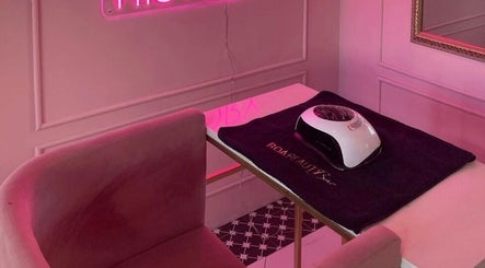 Elegant manicure station at BOA Beauty Bar Rondebosch, Cape Town, Western Cape, ZA with a plush pink chair.