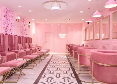 Elegant pink interior of BOA Beauty Bar Claremont, Cape Town, Western Cape, ZA. Luxurious seating and floral decor.
