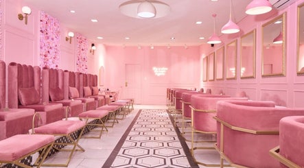 Elegant pink interior of BOA Beauty Bar Claremont, Cape Town, Western Cape, ZA. Luxurious seating and floral decor.