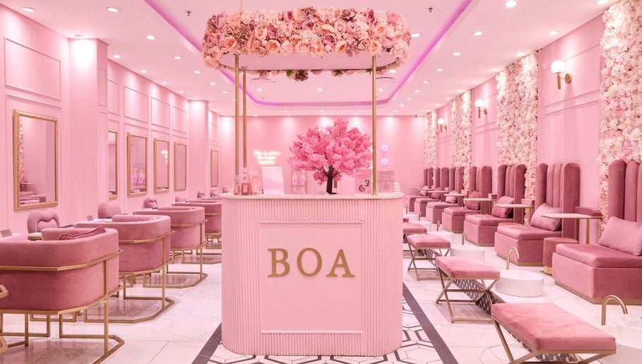 Chic interior of BOA Beauty Bar Durbanville, Cape Town, Western Cape, ZA, featuring pink decor and luxurious seating.
