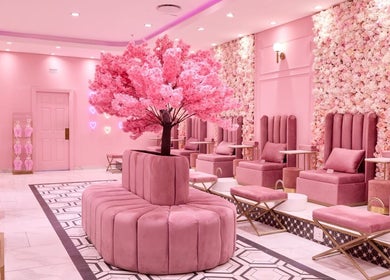 Luxurious pink seating area at BOA Beauty Bar Durbanville, Cape Town, Western Cape, ZA with floral decor.