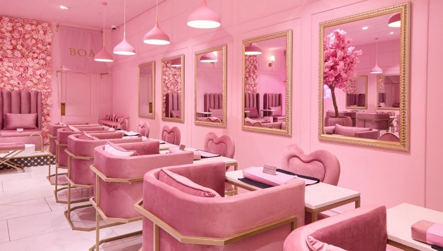 Stylish pink interior of BOA Beauty Bar Somerset West, Cape Town, Western Cape, ZA, showcasing plush seating.
