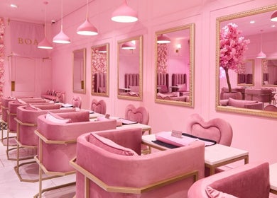 Stylish pink interior of BOA Beauty Bar Somerset West, Cape Town, Western Cape, ZA, showcasing plush seating.