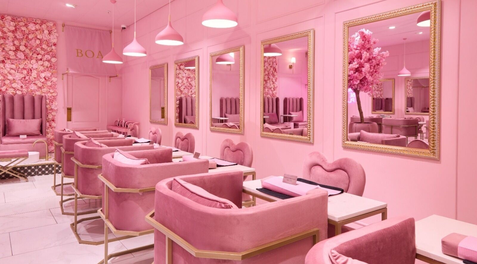 Stylish pink interior of BOA Beauty Bar Somerset West, Cape Town, Western Cape, ZA, showcasing plush seating.
