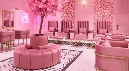 Chic pink lounge at BOA Beauty Bar Somerset West, Cape Town, Western Cape, ZA with floral wall accents.