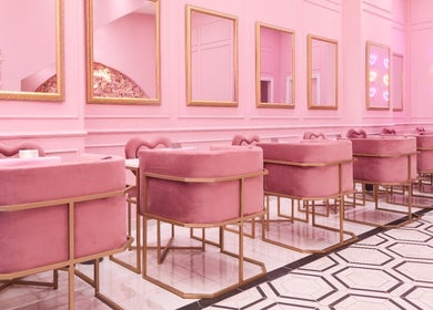 Chic pink seating area at BOA Beauty Bar Kloof Street, Cape Town, Western Cape, ZA with elegant decor.