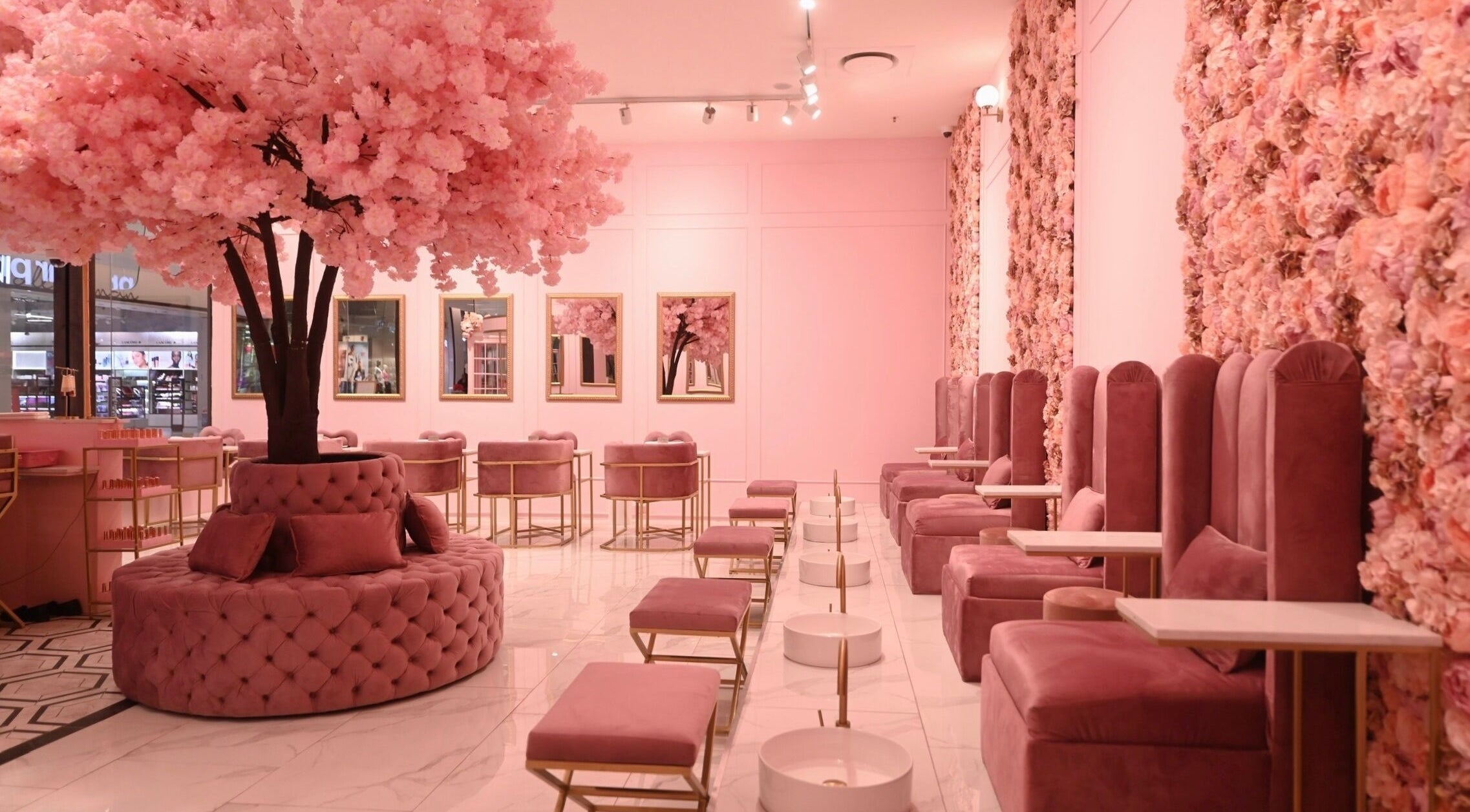 Luxurious pink seating area at BOA Beauty Bar Fourways Mall, Sandton, Gauteng, ZA with floral decor.