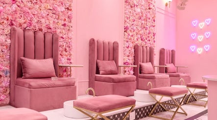Elegant pink pedicure lounge at BOA Beauty Bar Riverlands Mall in Cape Town, Western Cape, ZA adorned with flowers.