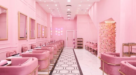 Chic pink interior of BOA Beauty Bar Buitengracht Street, Cape Town, Western Cape, ZA, featuring plush seating and floral decor.