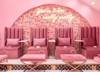Luxurious pink seating at BOA Beauty Bar Buitengracht Street, Cape Town, Western Cape, ZA for a relaxing experience.