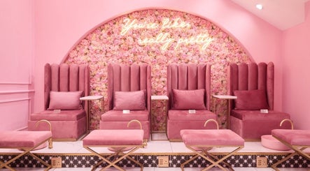 Luxurious pink seating at BOA Beauty Bar Buitengracht Street, Cape Town, Western Cape, ZA for a relaxing experience.