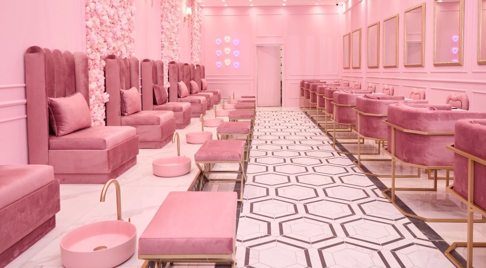 Luxurious pink interior of BOA Beauty Bar Ballito, Kwazulu-natal, ZA showcasing elegant seating and decor.