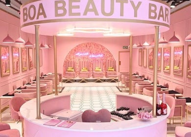 Chic interior of BOA Beauty Bar Mall Of The South, Alberton, Gauteng, ZA with elegant pink decor and seating.