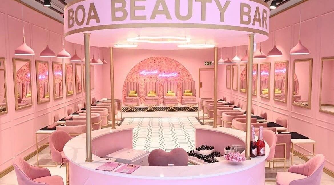 Chic interior of BOA Beauty Bar Mall Of The South, Alberton, Gauteng, ZA with elegant pink decor and seating.