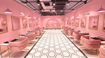 Chic pink interior of BOA Beauty Bar Mall Of The South, Alberton, Gauteng, ZA, featuring modern salon stations.