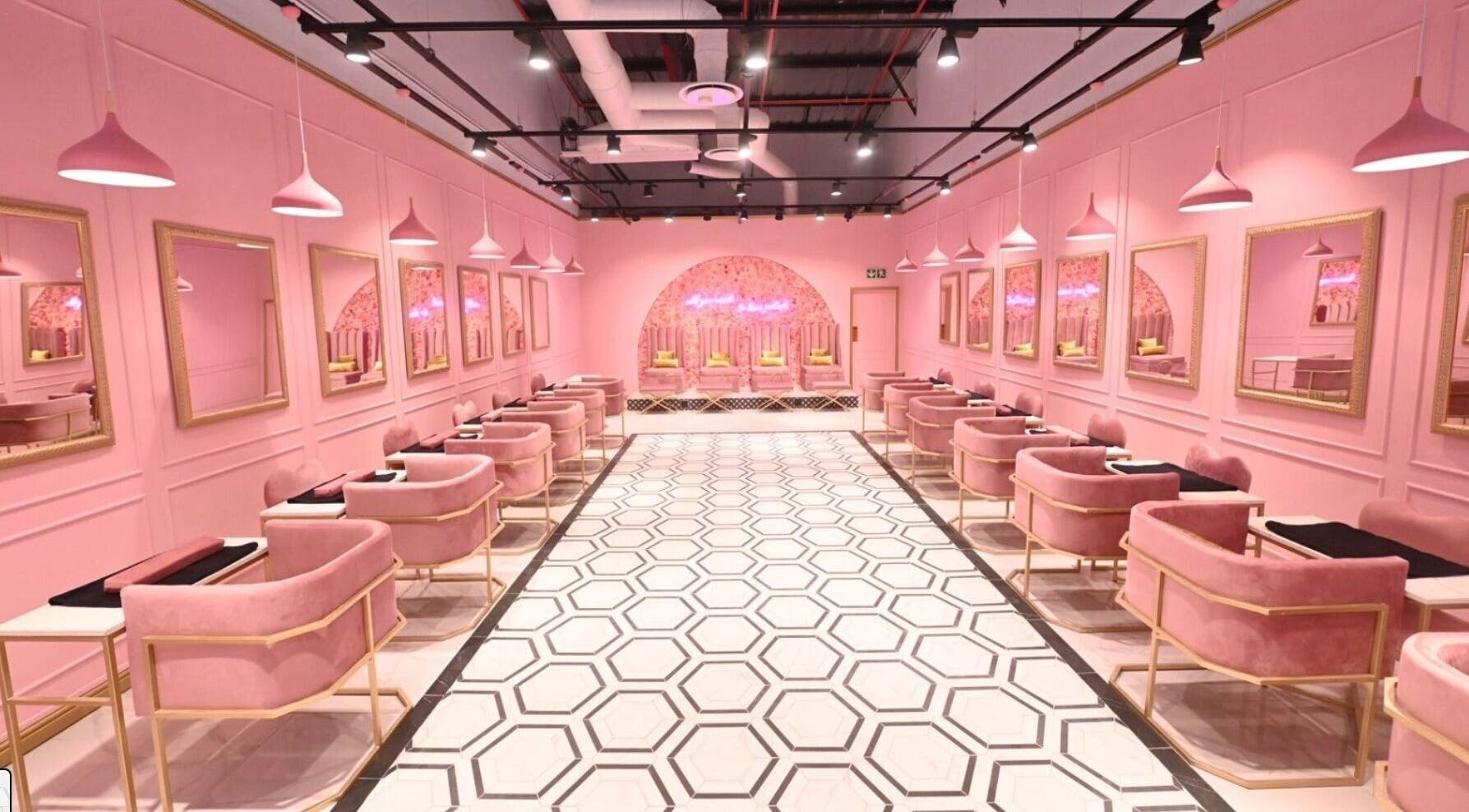 Chic pink interior of BOA Beauty Bar Mall Of The South, Alberton, Gauteng, ZA, featuring modern salon stations.