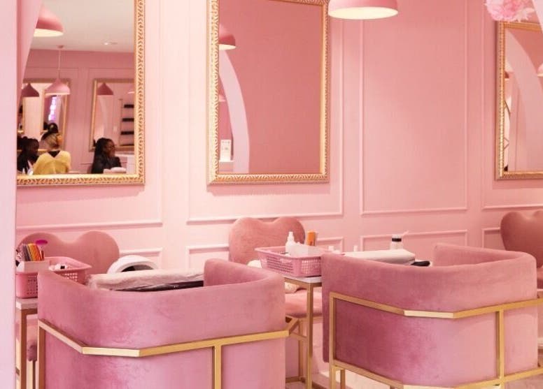 Elegant pink interior of BOA Beauty Bar Mall Of The South, Alberton, Gauteng, ZA with plush seating and mirrors.