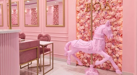 Elegant pink room at BOA Mushroom Farm, Midrand, Gauteng, ZA with a floral wall and carousel horse decor.