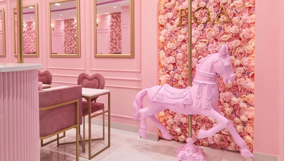 Stylish interior of BOA Beauty Bar Mushroom Farm in Midrand, Gauteng, ZA, featuring pink decor and floral accents.